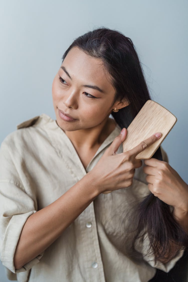 A Woman Brushing Her Long Hair