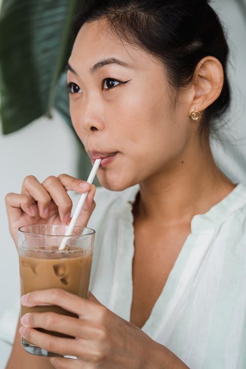 Woman Drinking an Iced Coffee