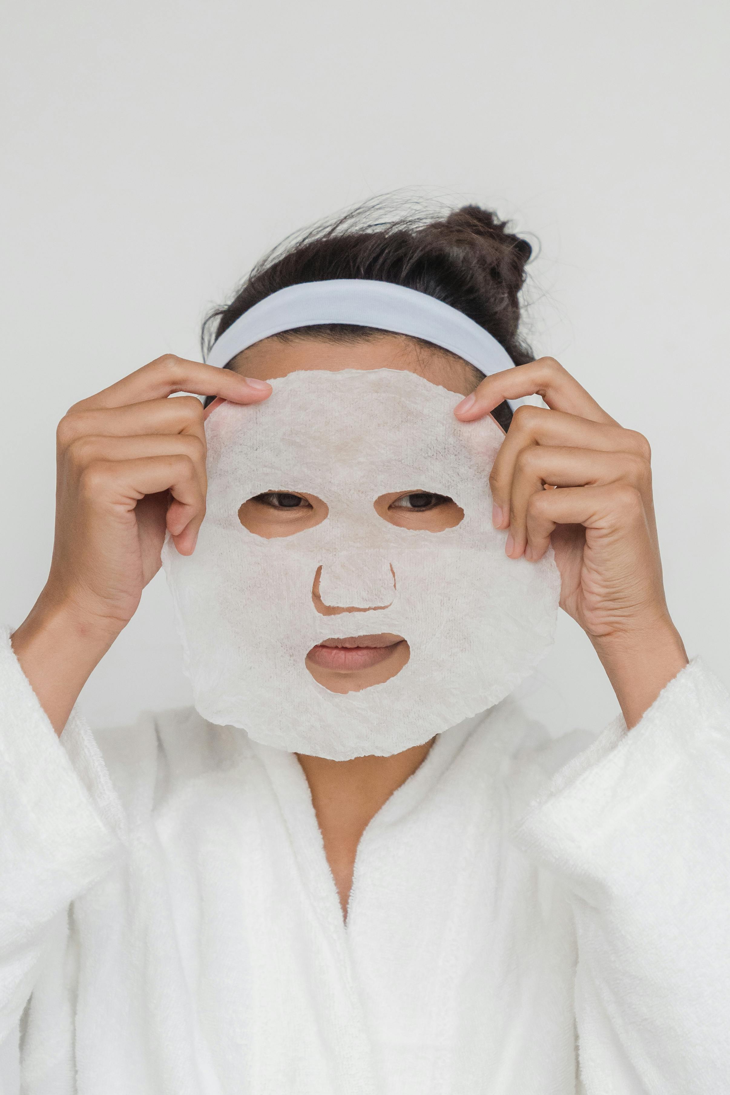 Close-Up Photo of a Person Applying Facial Cream on Her Face · Free ...