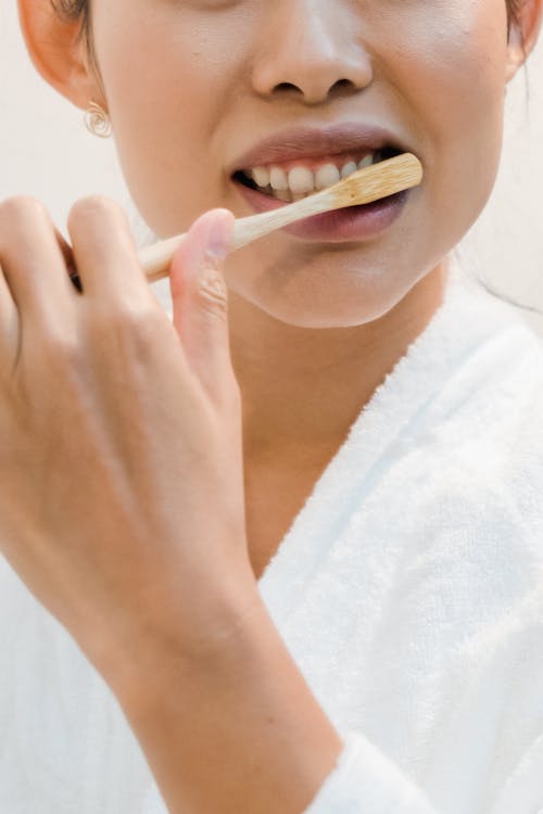 Close-Up Shot of a Person Brushing Her Teeth