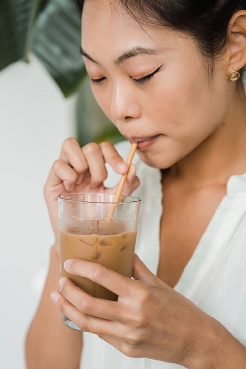 Woman Drinking an Iced Coffee