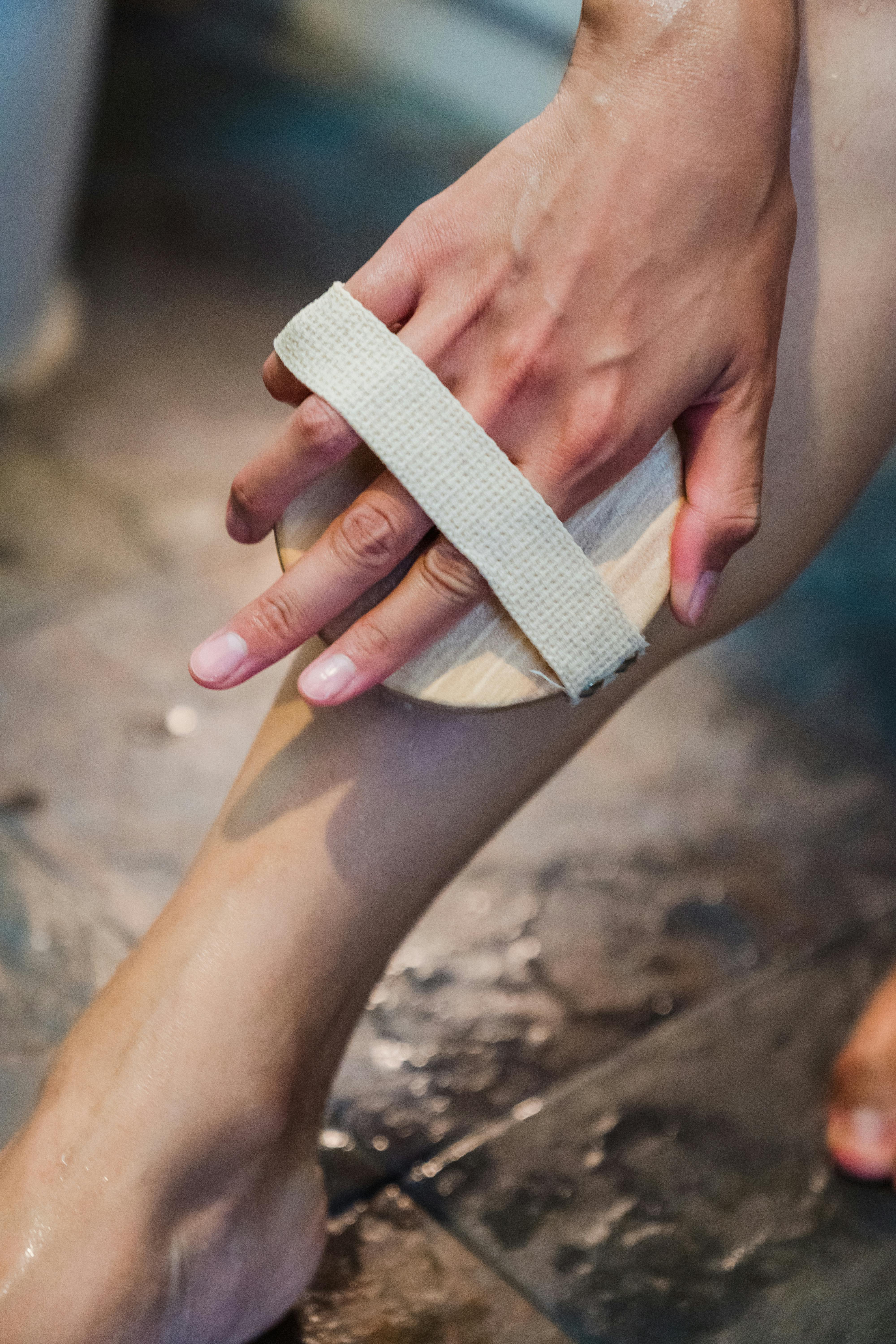 close up shot of a person using a body brush