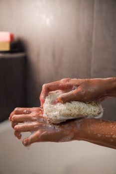 Close-Up Photo of a Person Using a Body Scrub
