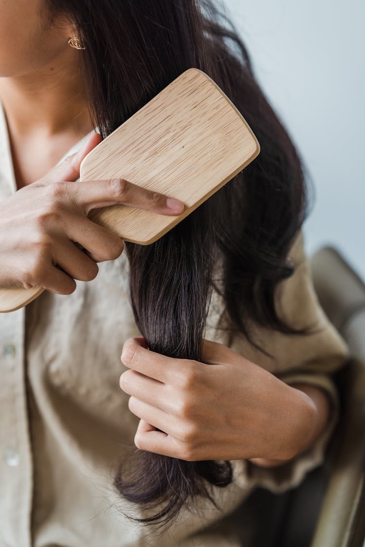 A Woman Brushing Her Long Hair