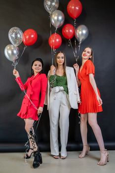 Woman in Red Blazer Holding Balloons