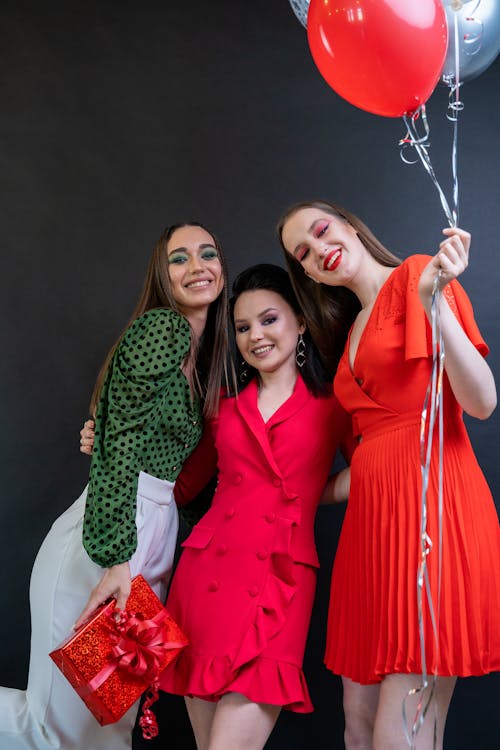 Elegant Women with Balloons on a Party