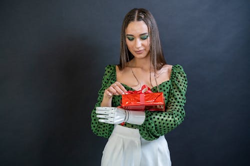 A Woman Holding a Red Gift