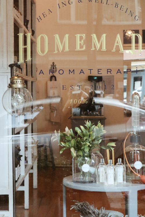 Free Rustic aromatherapy shop window with decor and wellness products on display. Stock Photo