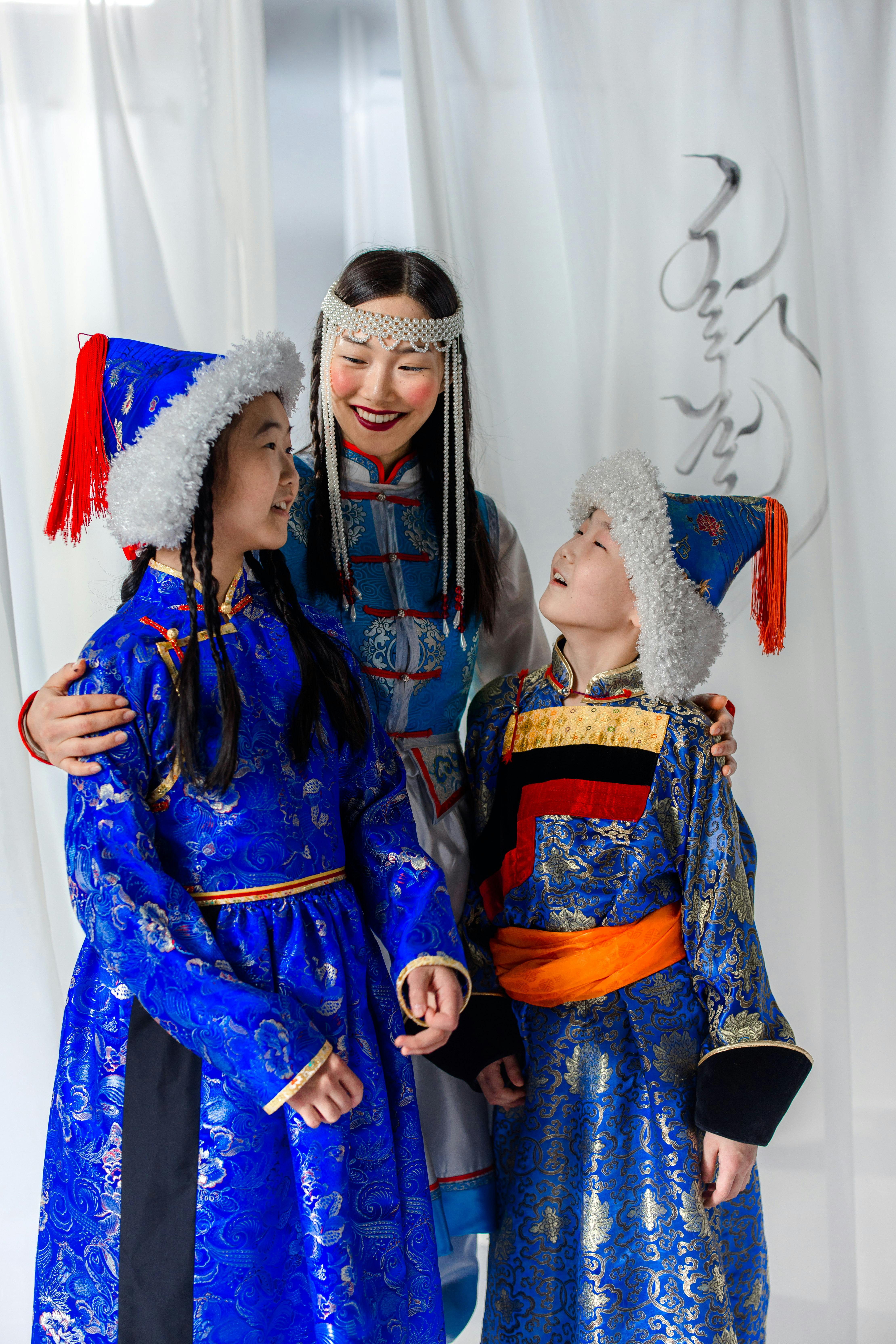 mother and daughters wearing traditional clothes