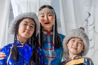 2 Women Wearing White Fur Hat