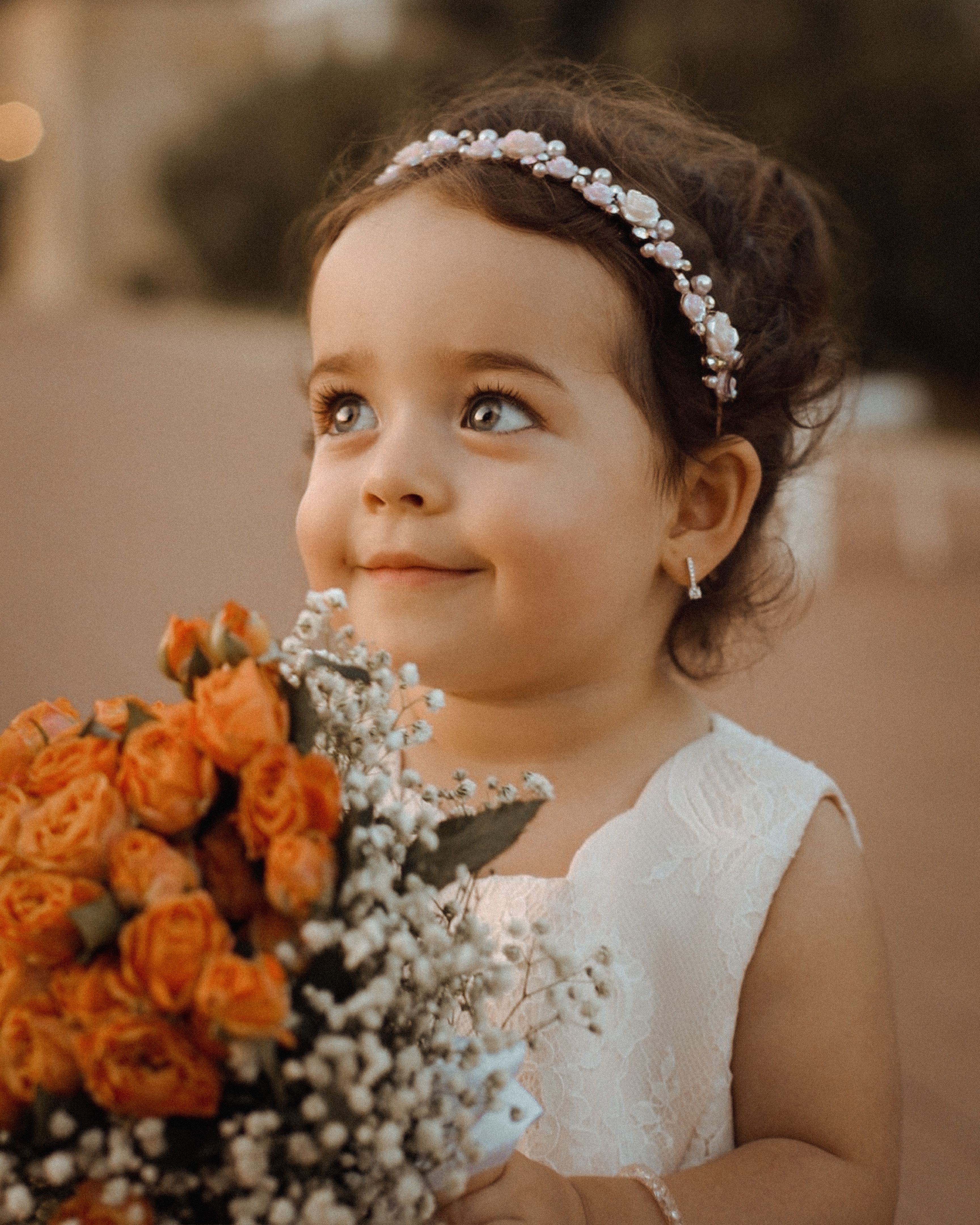 Cute Girl Holding a Bouquet of Flowers · Free Stock Photo