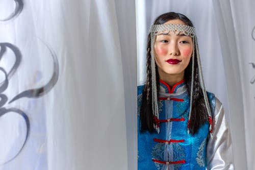 Woman with Braided Hair Wearing a Pearl Headpiece