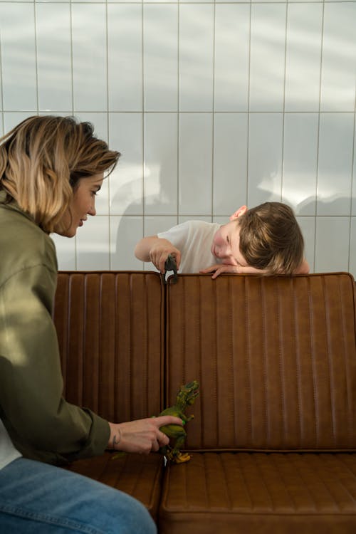 A Woman Playing with her Son on a Bench