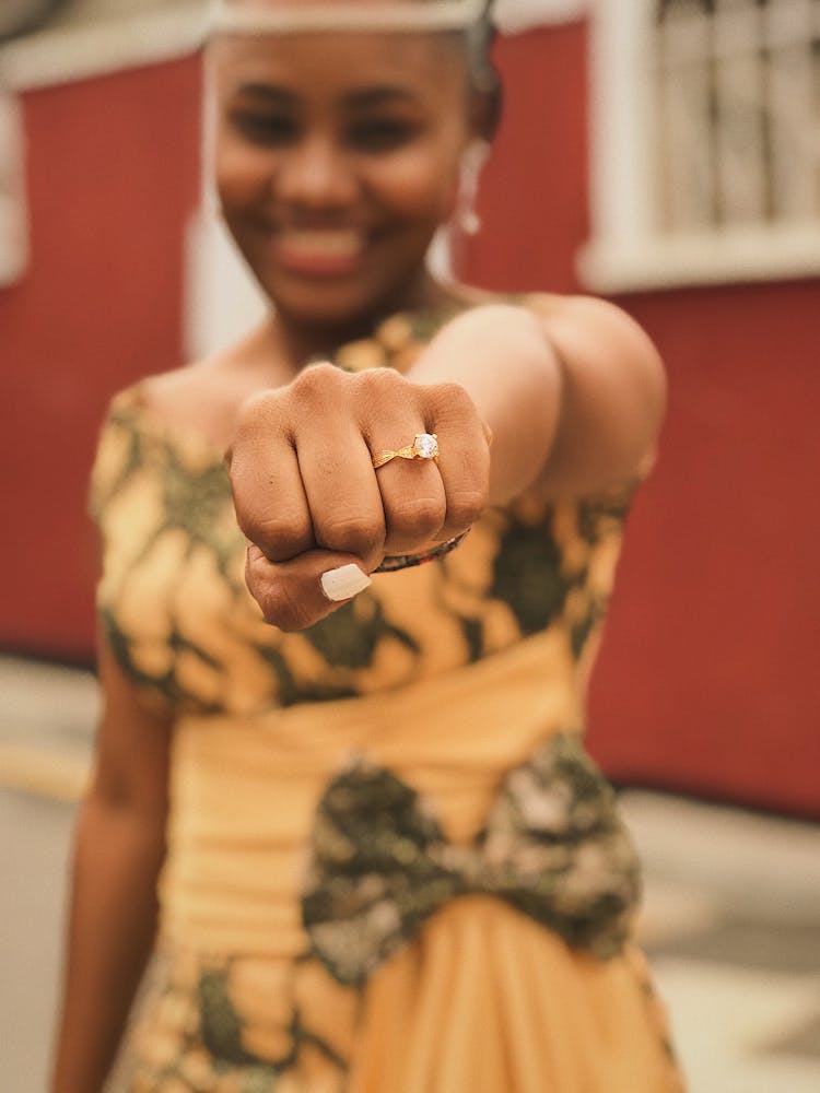 Smiling Woman Showing Hand With Ring