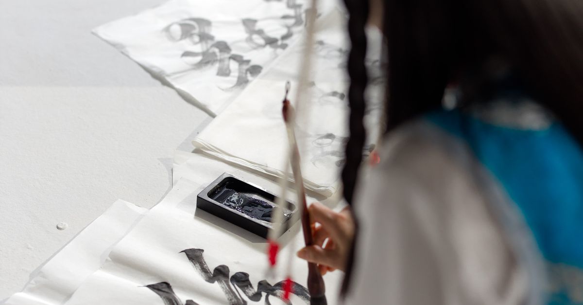 A Person Doing Calligraphy Art · Free Stock Photo