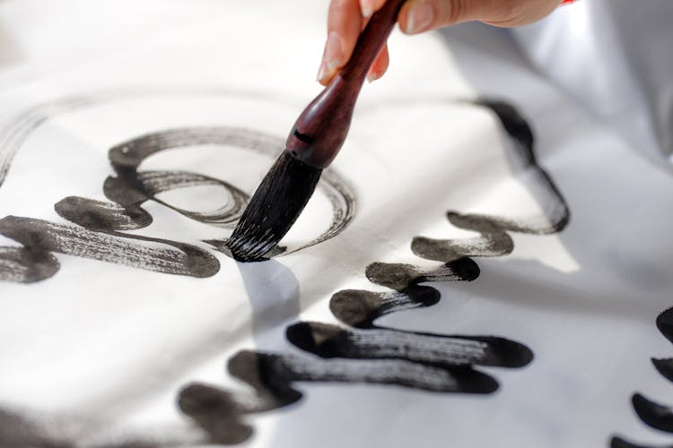 Calligraphy Using A Blank Ink And Paint Brush