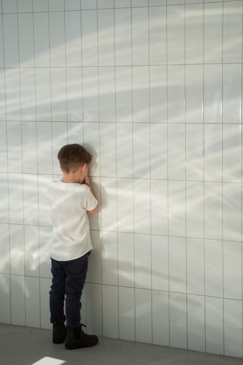 Boy Facing the Wall