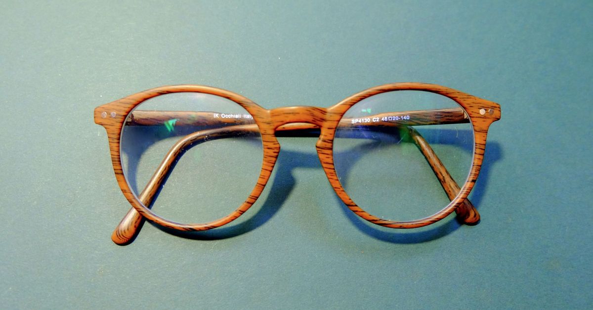Eyeglasses frame displayed on a wooden table