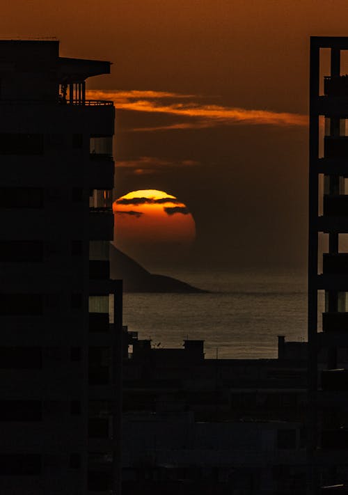 Silhouette of Buildings During Beautiful Sunset