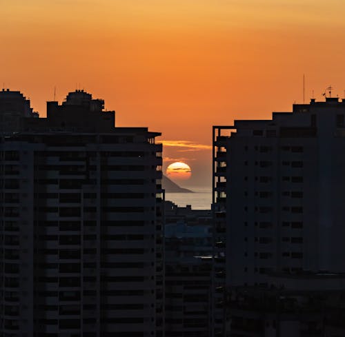 Silhouette of City Buildings During Beautiful Sunset