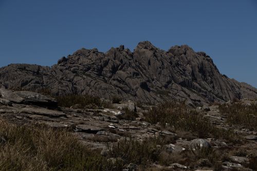 Free A rugged mountain landscape with rocky terrain under a clear blue sky, showcasing natural beauty. Stock Photo
