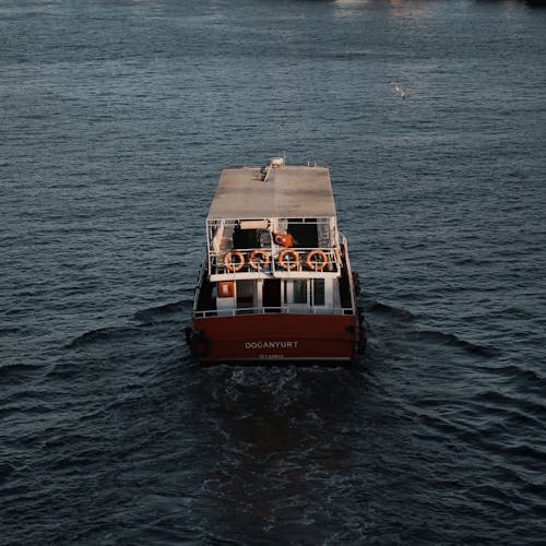 Red and White Ferry Boat on Sea