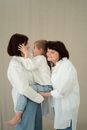 Woman in White Dress Shirt Kissing Woman in Blue Denim Jeans