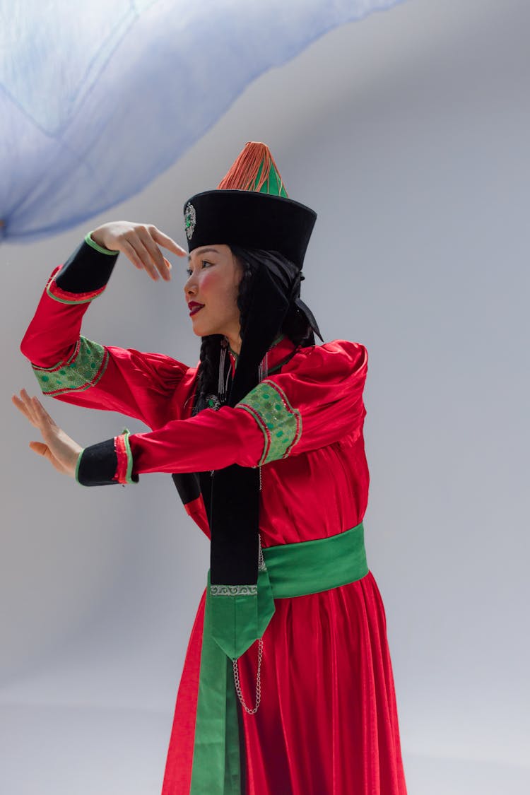 A Woman Wearing A Traditional Mongolian Dress