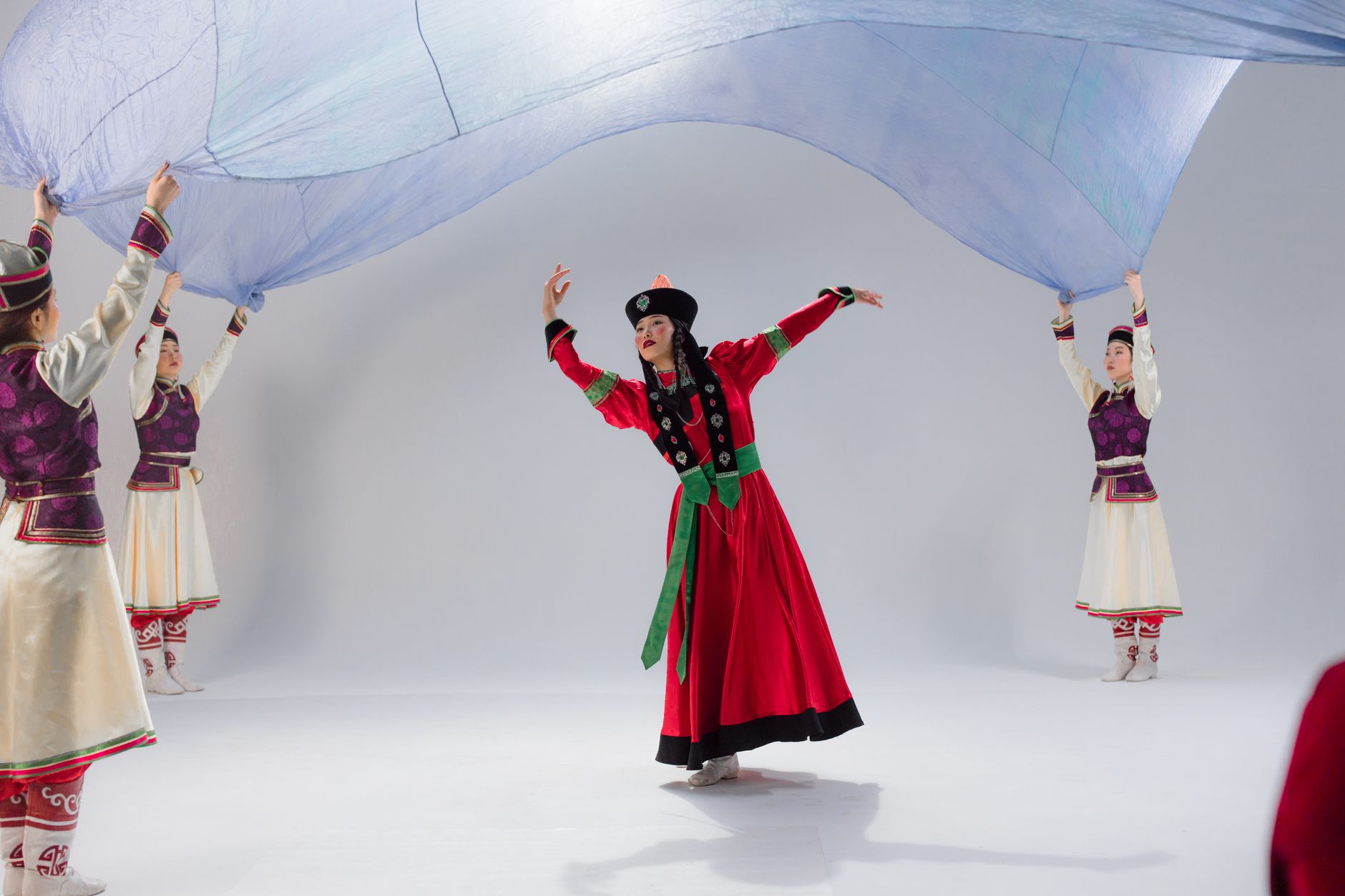 Vibrant display of traditional Mongolian dance in colorful costumes.