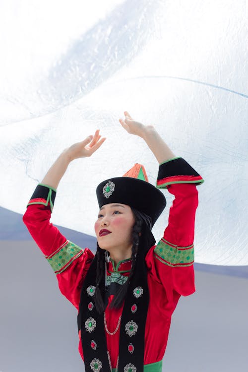 Woman Wearing Traditional Wear Raising Her Hands