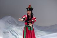Woman in Red Long Sleeved Dress Wearing Black Hat