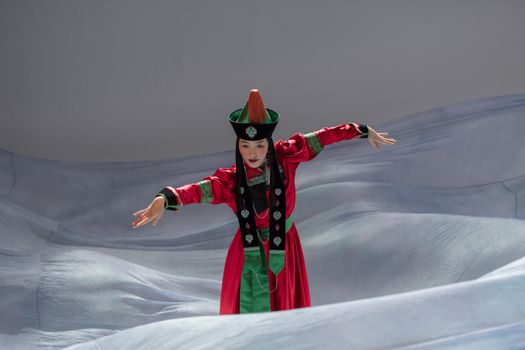 Woman in Traditional Clothing Seriously Dancing