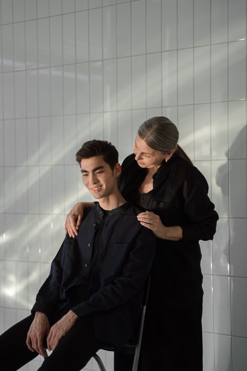 Free A tender moment between a mother and her son captured indoors with soft lighting. Stock Photo