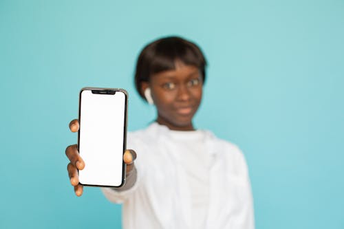 Woman holding an Iphone 