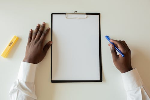 Free Blank Paper on a Clipboard Stock Photo