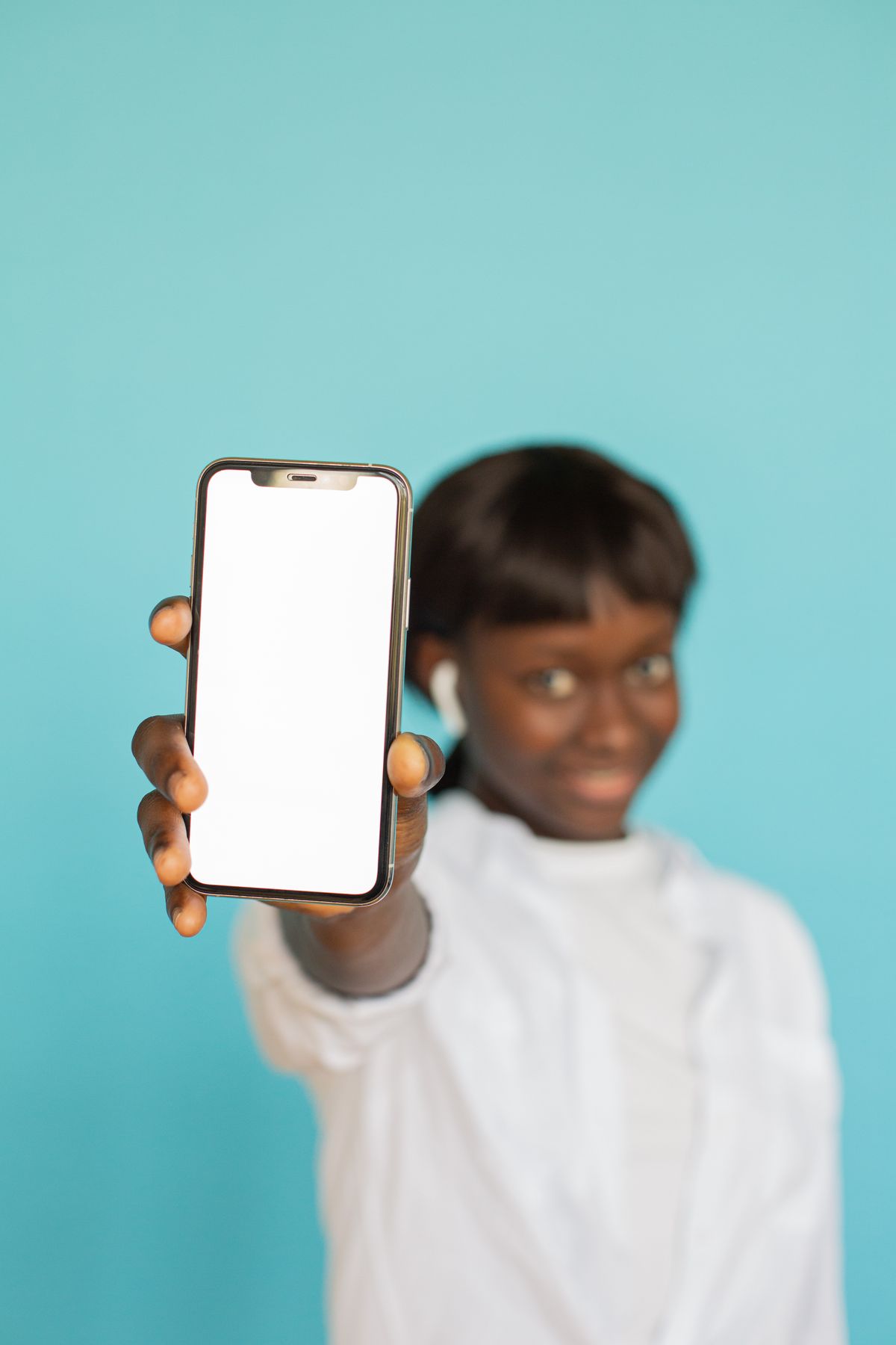 A woman holding out her phone screen