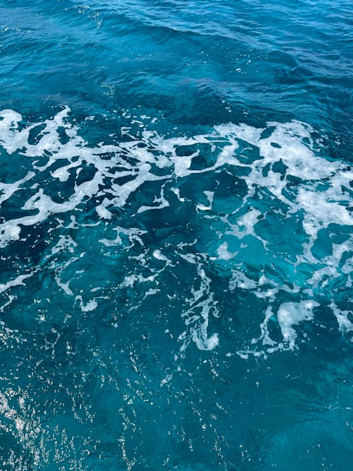 Close-Up Photo of Blue Ocean Water Surface