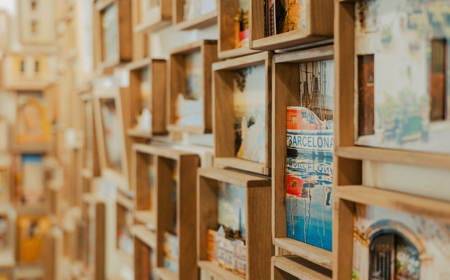 Wooden photo frames arranged as a wall display in a framing shop