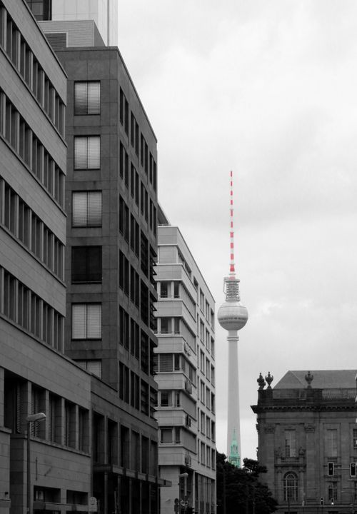 Free Vertical shot of the Berlin TV Tower among modern urban buildings in Germany. Stock Photo