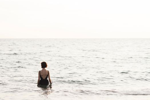 Woman in Black Bikini on Water