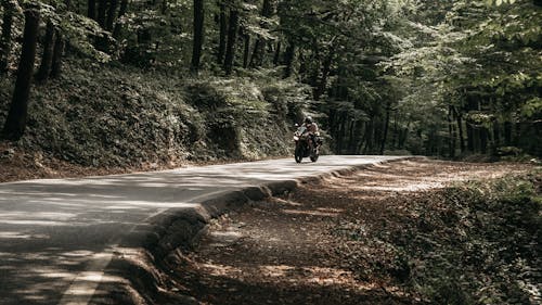 Photo of a Motorcyclist on a Road