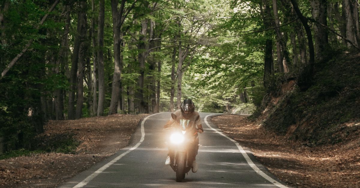 2 People Riding Motorcycle on Road · Free Stock Photo