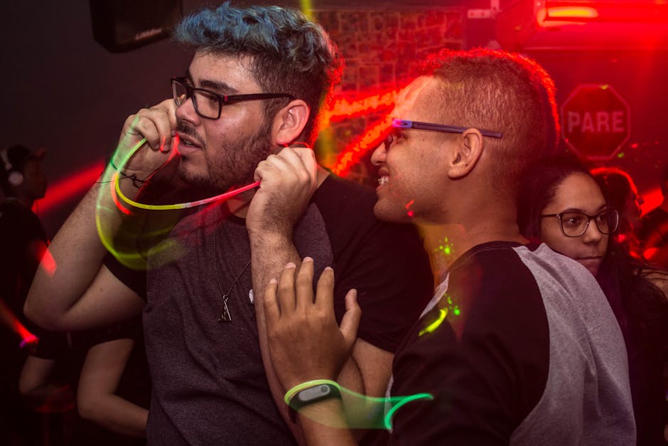Captivating nightlife scene with people enjoying vibrant music and neon lights in a lively nightclub.