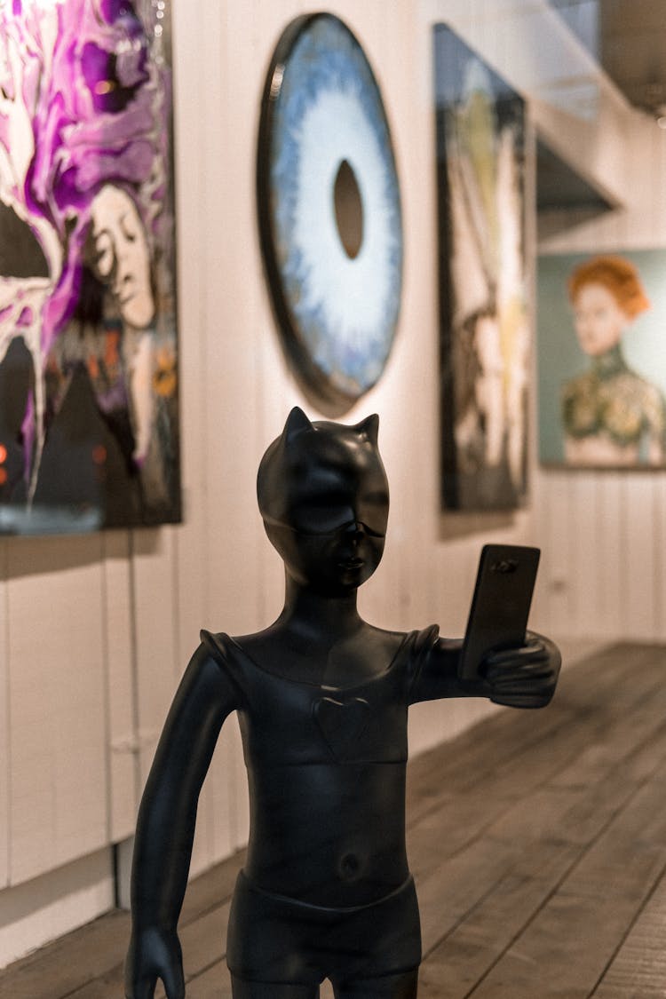 Black Figurine Of Cat Woman In Art Exhibition