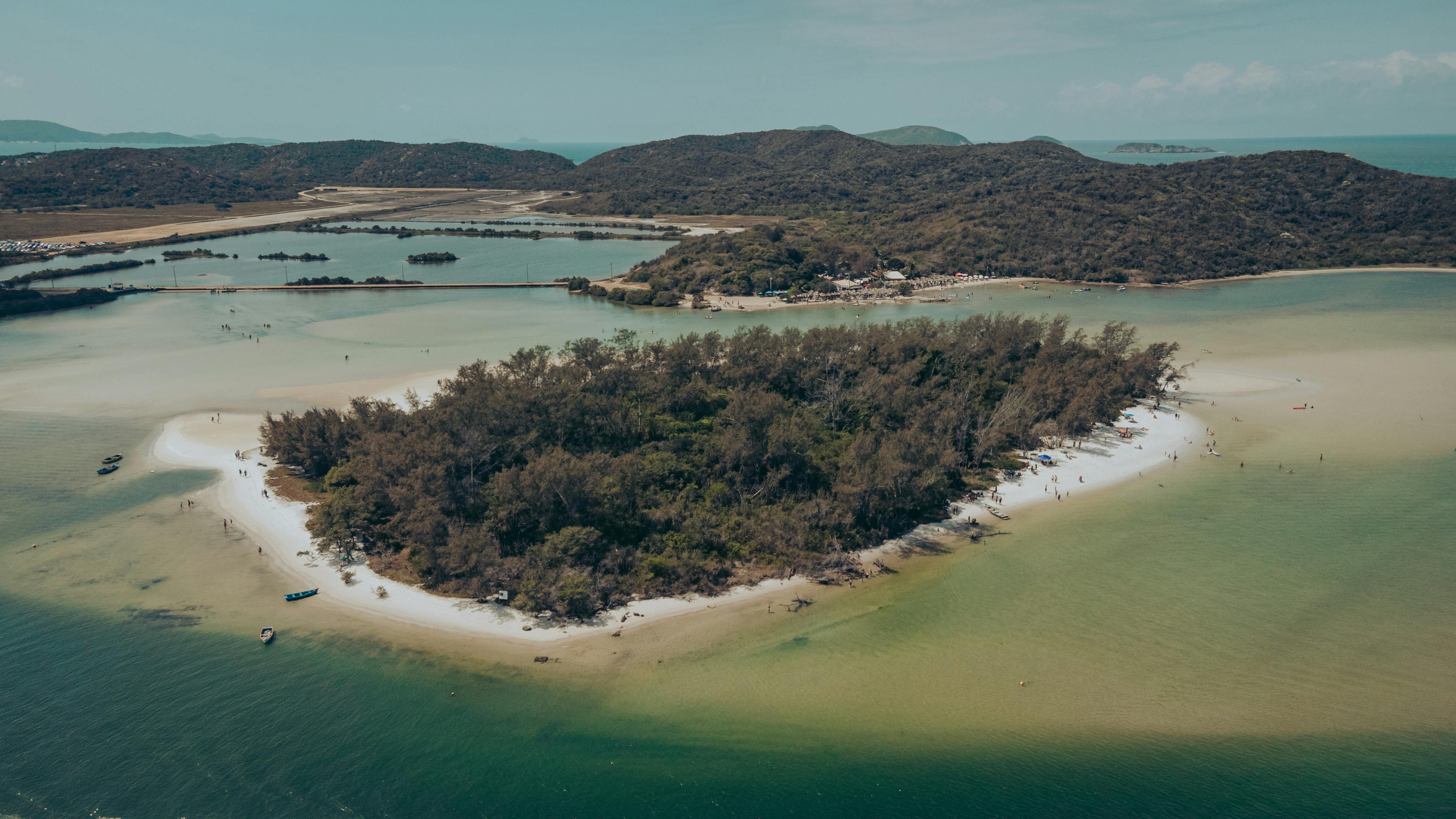Stunning aerial shot of a lush island surrounded by turquoise waters in Brazil