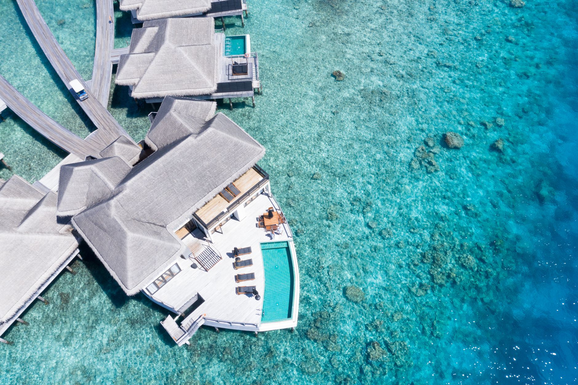Aerial view of Maldives overwater villas and lagoon