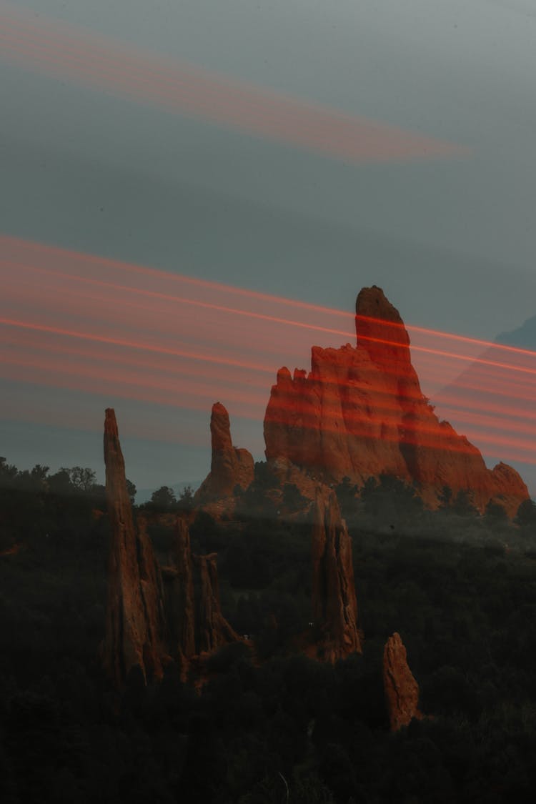 Rock Mountain On Sunset Through Window