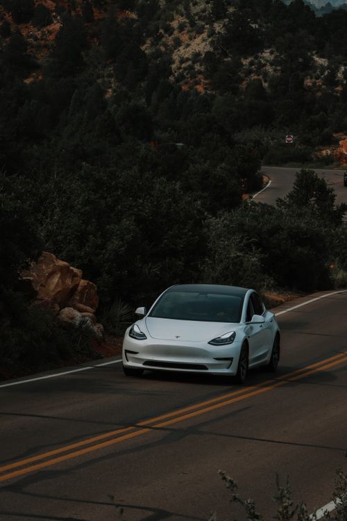 White Sedan Car Moving on the Road · Free Stock Photo