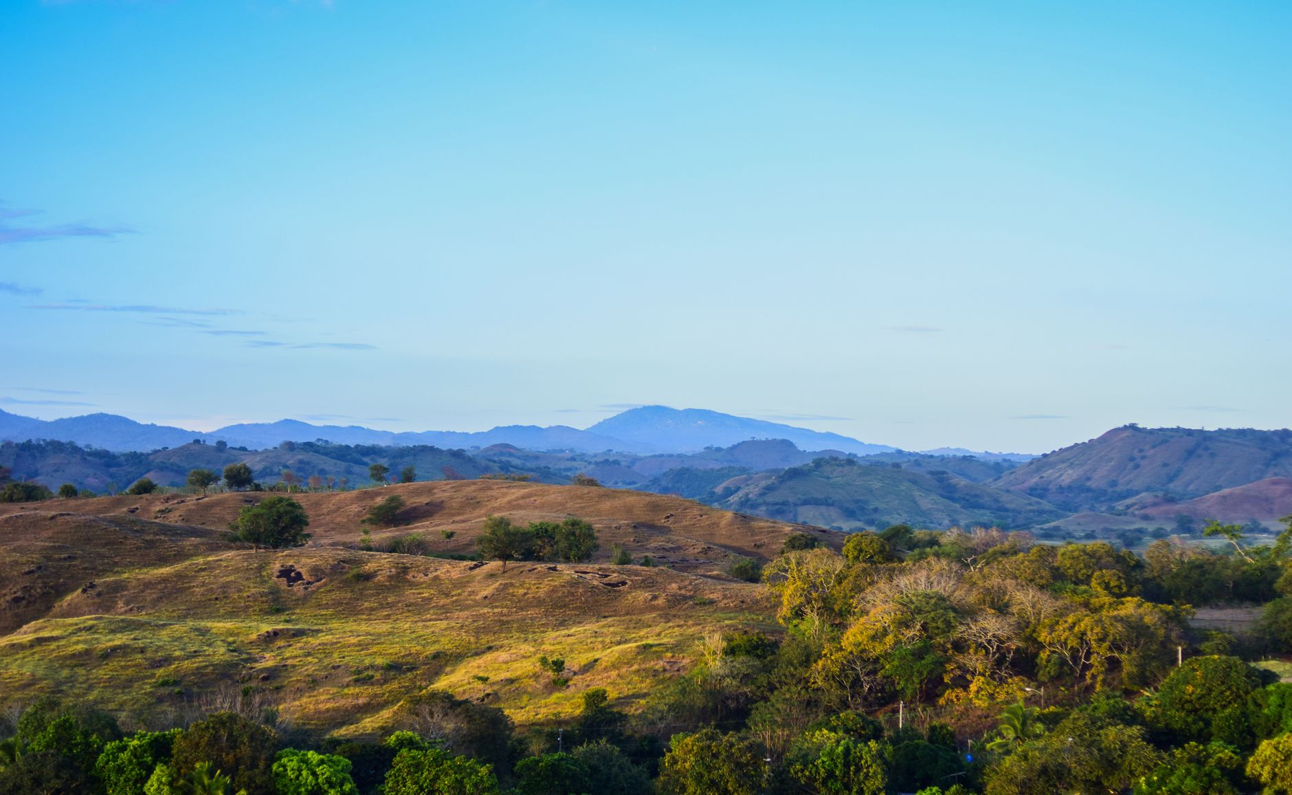 Peaceful panoramic view of rolling hills and distant mountains in Los Santos, Panama.