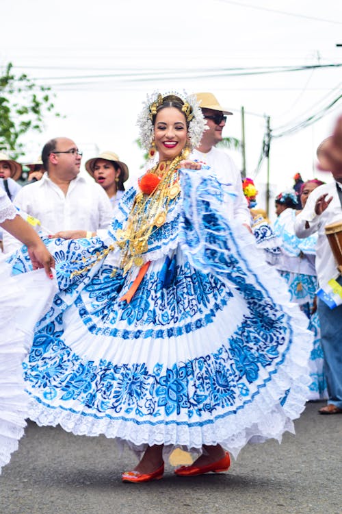 Woman in White and Blue Costume Dancing 